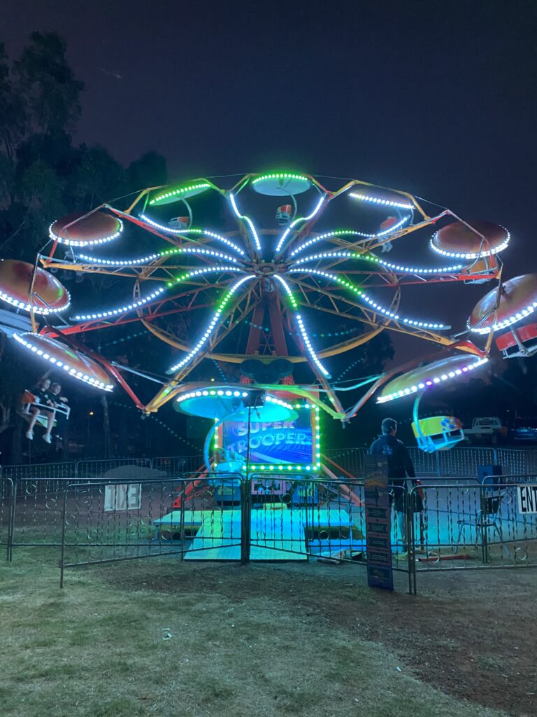 The brightly lit Super Trooper show ride after dark at the 2022 Toodyay Show.