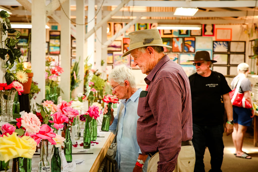 Visitors taking in the beauty of the floriculture entries in the Lee Steere Pavilion.